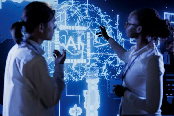 Two female researchers analyzing a glowing digital brain interface with AI technology.